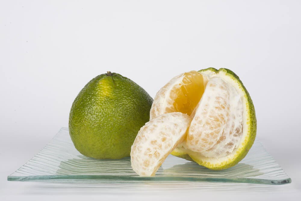 Анлак агли. Цитрусовые агли. Агли (углифрут). Зелёный фрукт похожий на апельсин. Фрукт похожий на лайм.
